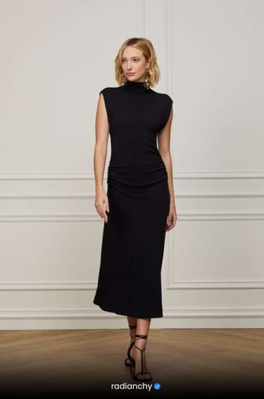 a woman in a black dress and sandals