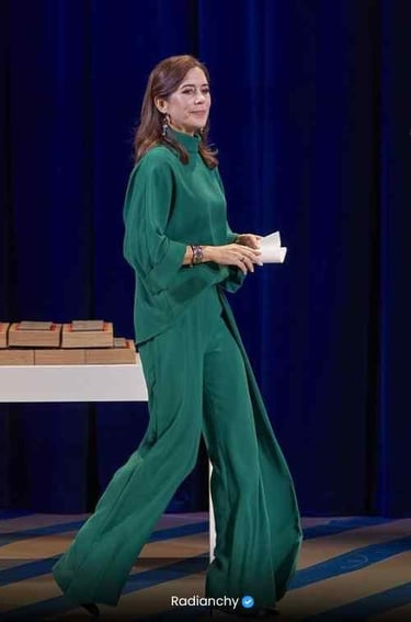 a woman in a green dress and a man in a suit