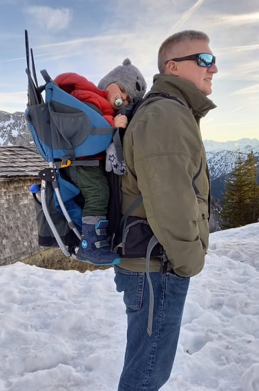 Father and son on snowy mountain