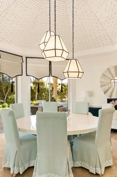 Dining space at Villa El Rincon with arched windows