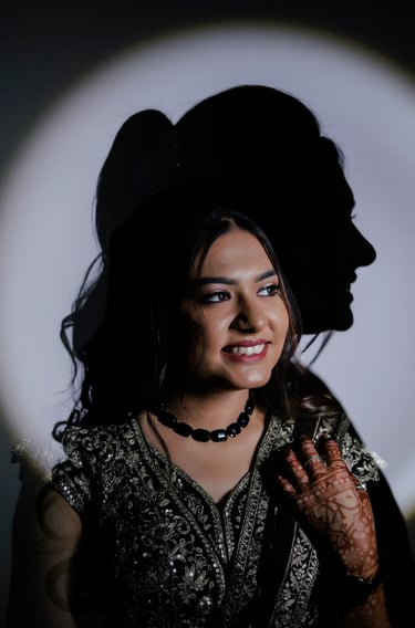 Creative bridal portrait with shadow light effect showing Indian bride with natural glowing bridal m