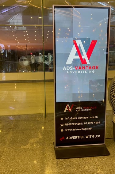 alt="digital advertising screen inside Bicol International Airport departure area Philippines"
