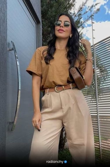 a woman in a tan top and tan pants