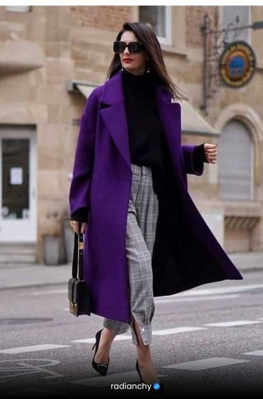 a woman in a purple coat and black heels