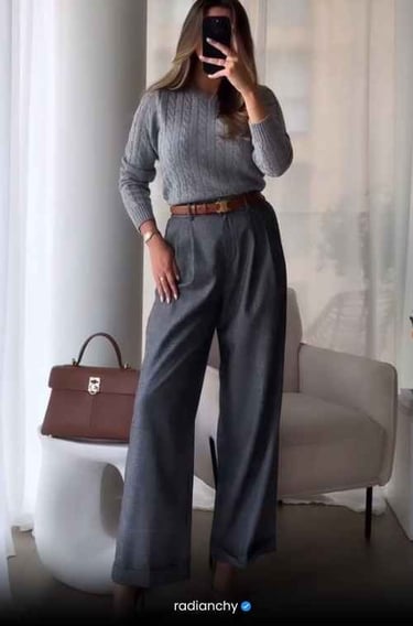 a woman in a gray sweater and pants