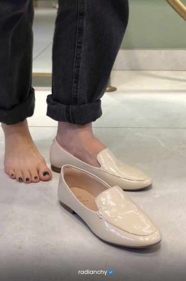 a person standing on a steplade with their feet on the ground