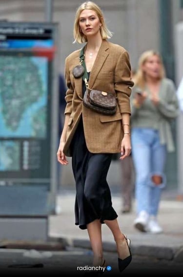 a woman in a brown jacket and black shoes