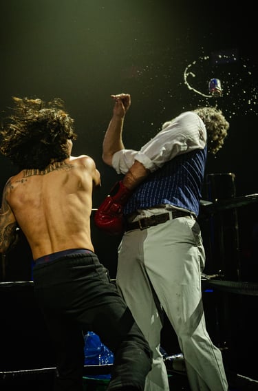 person getting punch with beer flying in the air