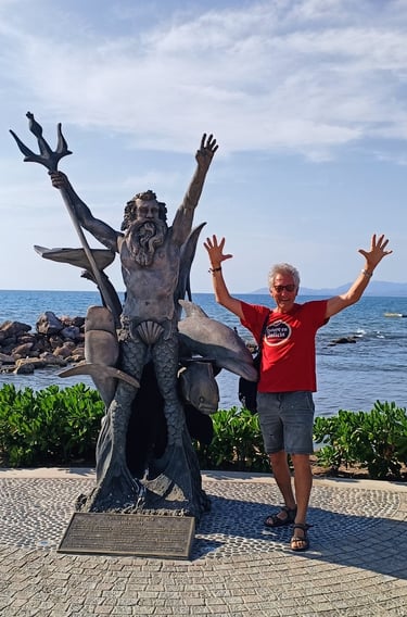 Jan Larsson with Neptune statue at Playa Linda promenade