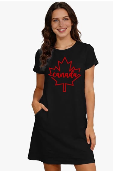 Smiling woman wearing a black t-shirt dress with a red Canada maple leaf graphic and side pockets.