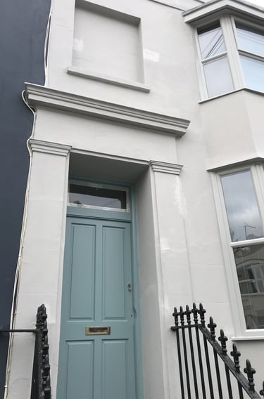 Townhouse exterior painting in Shoreham-by-Sea Sussex, white facade and painted door