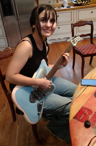 My daughter, famous painter, plays her Tumbleweed "Electric Barbarella"