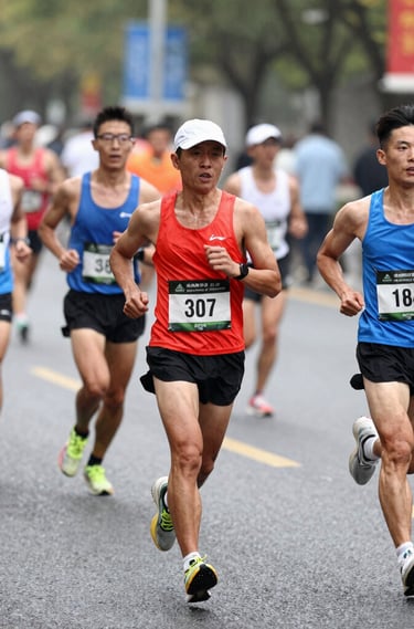 A male runner starting a race on a track.