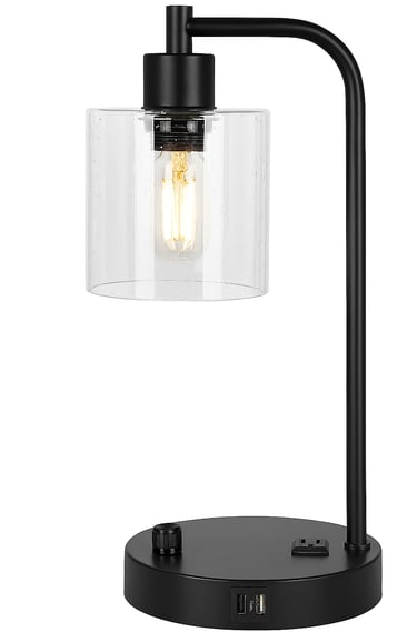 Black bedside lamp with USB port and clear glass shade on white