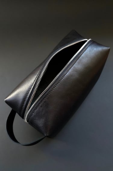 Black travel toiletry bag with handle