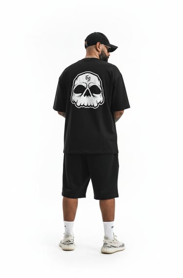 a man in a black shirt and shorts with a skull head