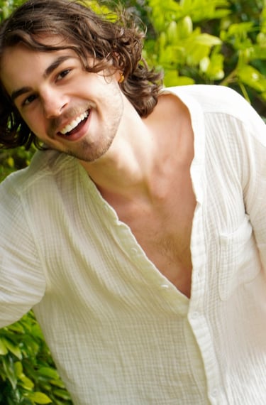 a man with a beard and a white shirt