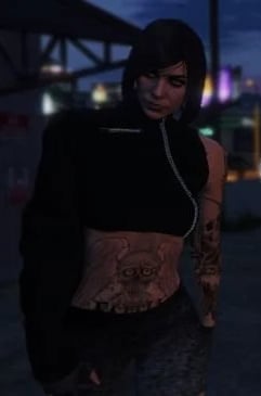 a woman in a black top and a black top with a tattoo on her chest