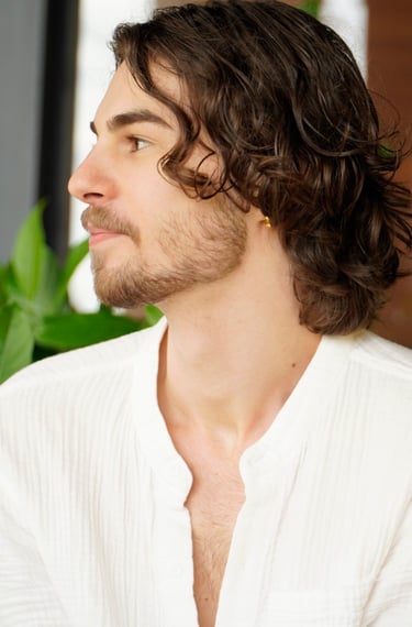 a man with a beard and a white shirt