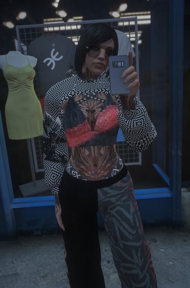 a woman in a top hat and sunglasses taking a selfie
