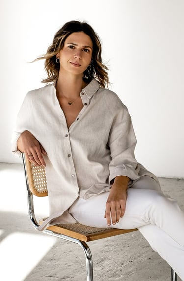 an interior designer sitting  in a chair