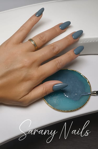 a woman's hand with a manicured manicured nail polish