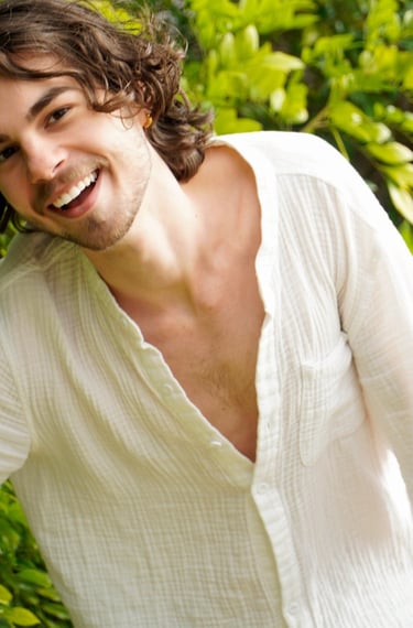 a man with a beard and a white shirt