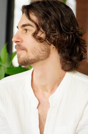 a man with a beard and a white shirt
