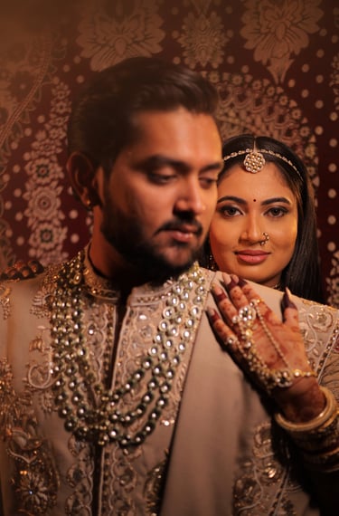Romantic pre-wedding portrait of a smiling Indian bride with eyes closed, highlighting her glowing b