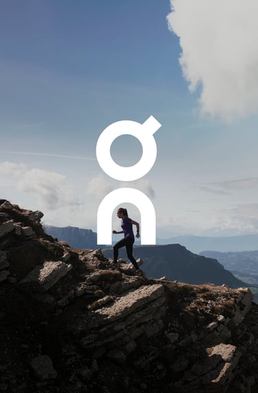 person running along the edge of a mountain