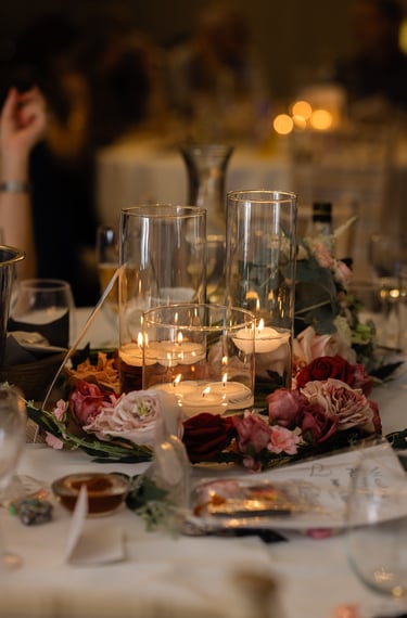 Candle and glass flower centrepieces at The Mill House Hotel