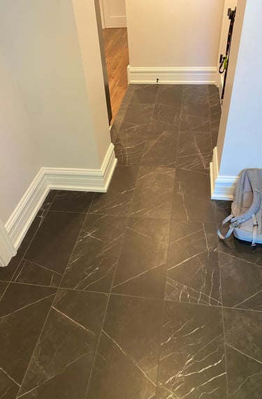 Hallway with 12x24 marble tile flooring