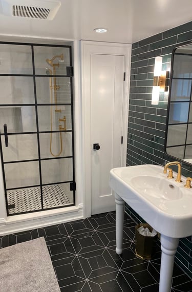 Elegant bathroom walls with classic subway tile pattern and mosaic marble floor.