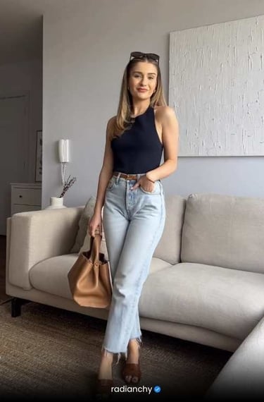 a woman in a black top and jeans jeans
