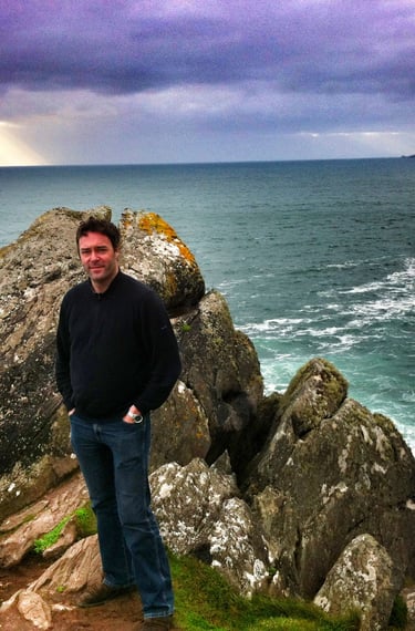 Genealogist standing on rock in County Kerry Ireland 