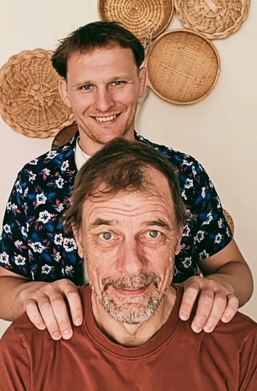a man with a beard and other man with a red shirt