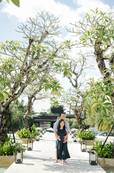 Couple photography session along the tropical garden walkway at The Apurva Kempinski Bali