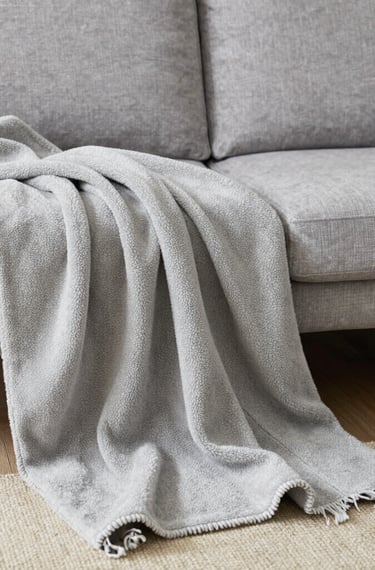A collection of colorful soccer jerseys is laid out, each featuring distinctive team logos and color patterns. The jerseys include stripes, stars, and various shades, providing a rich visual contrast.