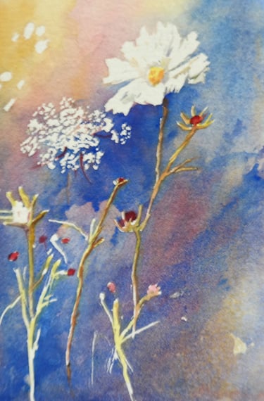 a watercolor of delicate flowers against blue sky 
