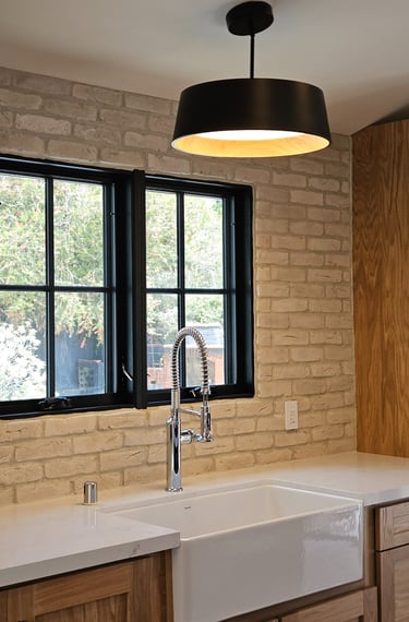 Modern kitchen lighting installed during a residential electrical renovation