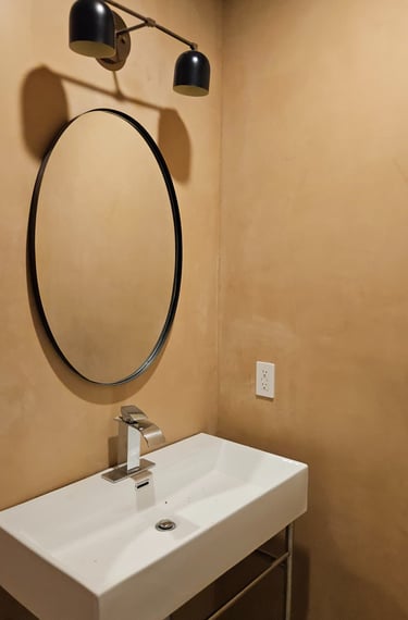 Bathroom vanity lighting installation in a remodeled residential home