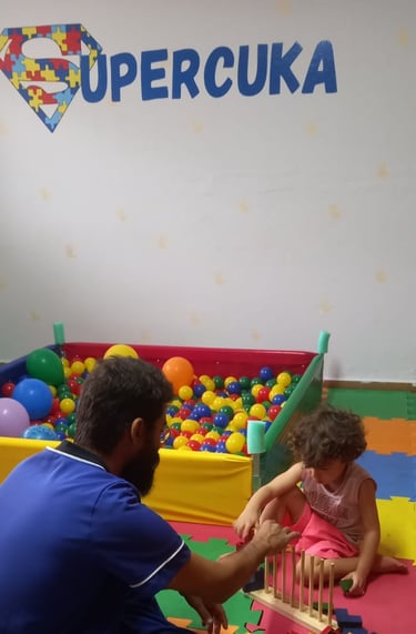 a man and a little boy playing with blocks and toys