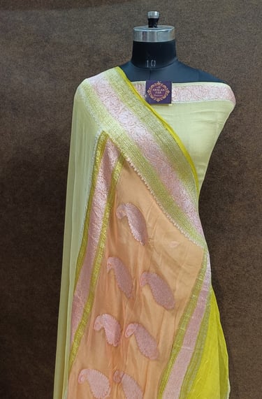 a chiffon saree with a yellow and peach pallu