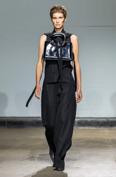 Johanna Parv sleeveless black top with statement bag at London Fashion Week 2026.