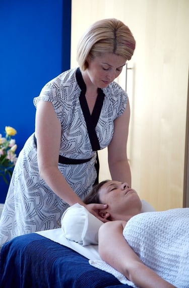 Julia massaging a patient. Tuina