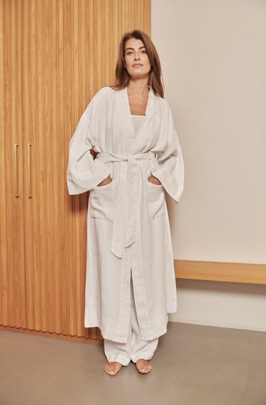a woman in a white robe and a white robe