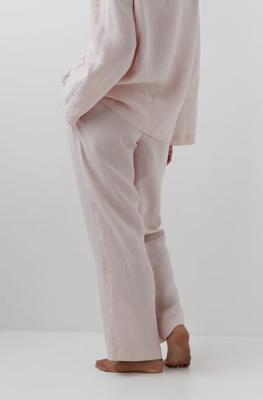 a woman in a pink shirt and pants