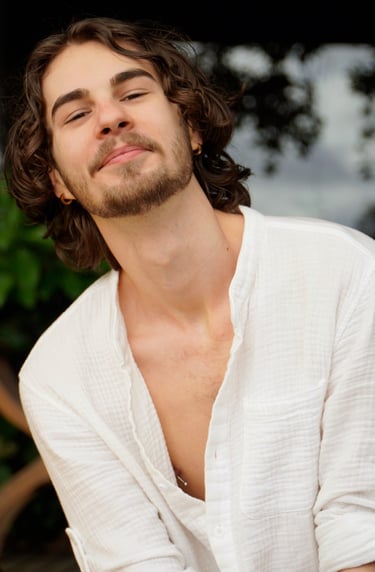 a man with a beard and a white shirt