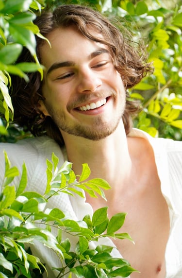 a man with a beard and a white shirt