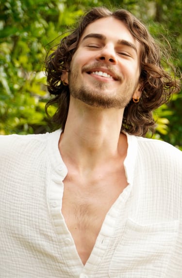 a man with a beard and a white shirt